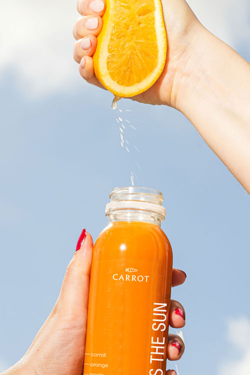 Here Comes the Sun Cold pressed Juice with an orange squeeze